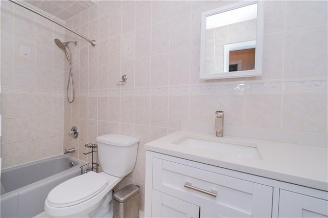 5 Haywood St, Staten Island, NY 10307 - bathroom with tile walls, vanity, toilet, and shower / bathtub combination