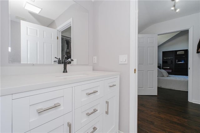 5 Haywood St, Staten Island, NY 10307 - bathroom featuring vanity, wood finished floors, vaulted ceiling, and connected bathroom