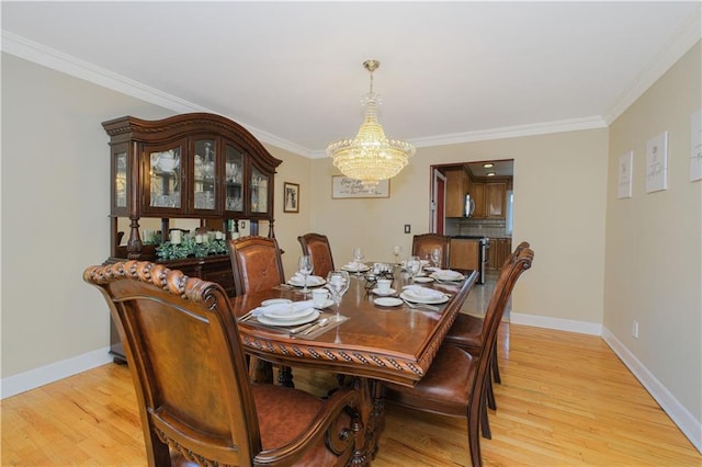 5 Haywood St, Staten Island, NY 10307 - dining room featuring a chandelier, ornamental molding, light wood-type flooring, and baseboards