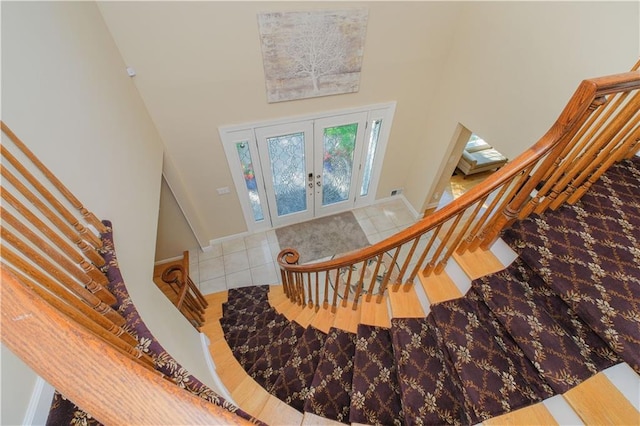 5 Haywood St, Staten Island, NY 10307 - staircase with a towering ceiling, french doors, tile patterned floors, and baseboards