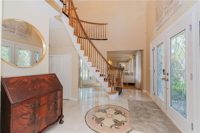 5 Haywood St, Staten Island, NY 10307 - entryway featuring french doors, stairway, a towering ceiling, and tile patterned floors