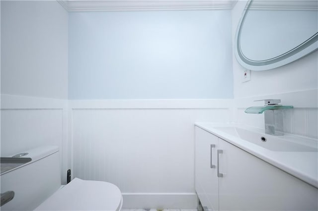 542 Golfview Ct Unit 1, Staten Island, NY 10314 - half bathroom with vanity, toilet, a wainscoted wall, a decorative wall, and crown molding