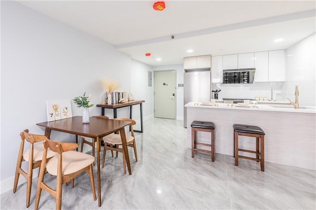 811 45th St Unit 5B, Brooklyn, NY 11220 - dining room with baseboards and recessed lighting