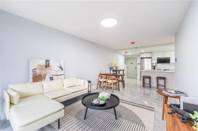 811 45th St Unit 5B, Brooklyn, NY 11220 - living room featuring light marble finish floors