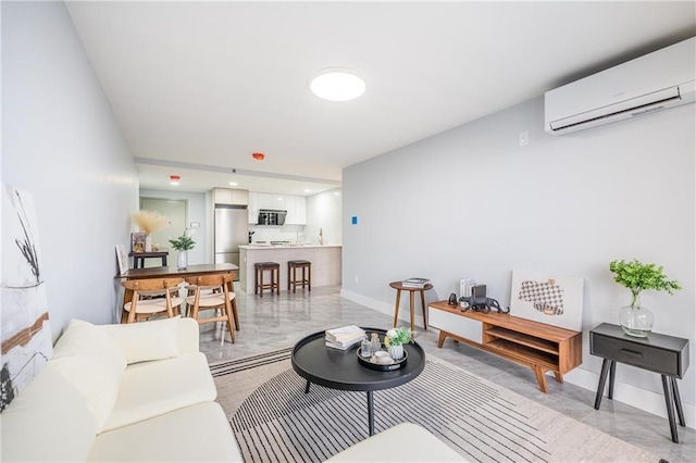 811 45th St Unit 5B, Brooklyn, NY 11220 - living room featuring a wall mounted air conditioner, light marble finish flooring, and baseboards