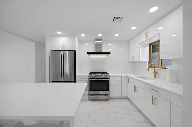 164 Railroad St, Staten Island, NY 10312 - kitchen featuring appliances with stainless steel finishes, wall chimney range hood, a sink, light marble finish flooring, and white cabinets