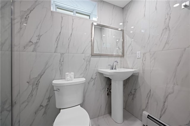 164 Railroad St, Staten Island, NY 10312 - bathroom featuring baseboard heating, toilet, tile walls, and a sink