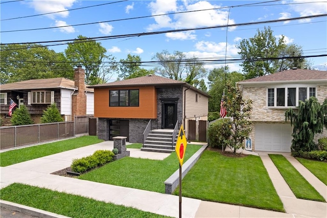 164 Railroad St, Staten Island, NY 10312 - bi-level home featuring driveway, an attached garage, and brick siding