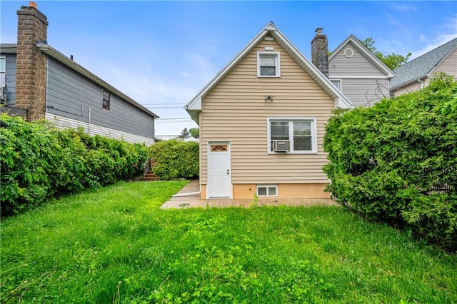 1347 E 57th St, Brooklyn, NY 11234 - rear view of house featuring a chimney, a yard, and cooling unit