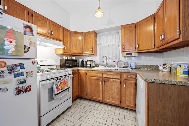 1347 E 57th St, Brooklyn, NY 11234 - kitchen featuring white appliances, under cabinet range hood, a sink, brown cabinets, and brick patterned flooring
