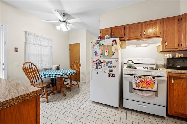 1347 E 57th St, Brooklyn, NY 11234 - kitchen featuring white appliances, under cabinet range hood, and brown cabinetry