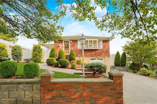 389 Sycamore St, Staten Island, NY 10312 - view of front of property featuring concrete driveway, a garage, and brick siding