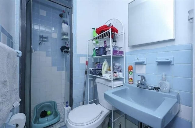 8784 24th Ave, Brooklyn, NY 11214 - bathroom with tile walls and a stall shower