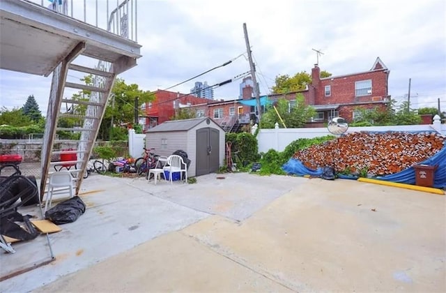 8784 24th Ave, Brooklyn, NY 11214 - view of patio / terrace featuring a shed