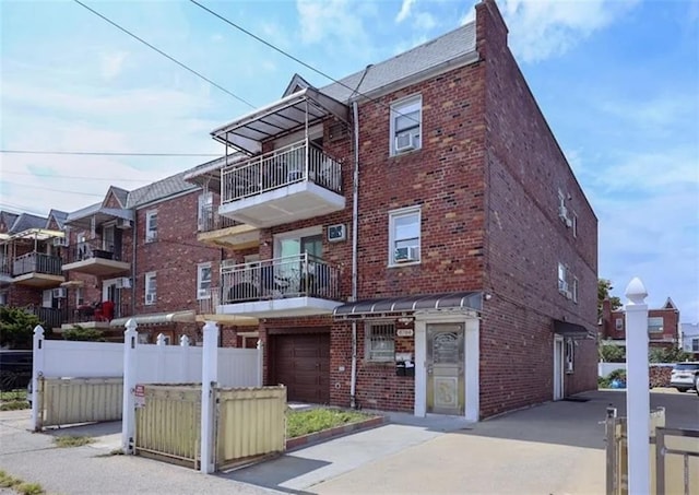 8784 24th Ave, Brooklyn, NY 11214 - view of building exterior with a garage