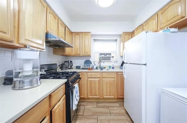 8784 24th Ave, Brooklyn, NY 11214 - kitchen featuring freestanding refrigerator, gas range, light brown cabinetry, under cabinet range hood, and decorative backsplash