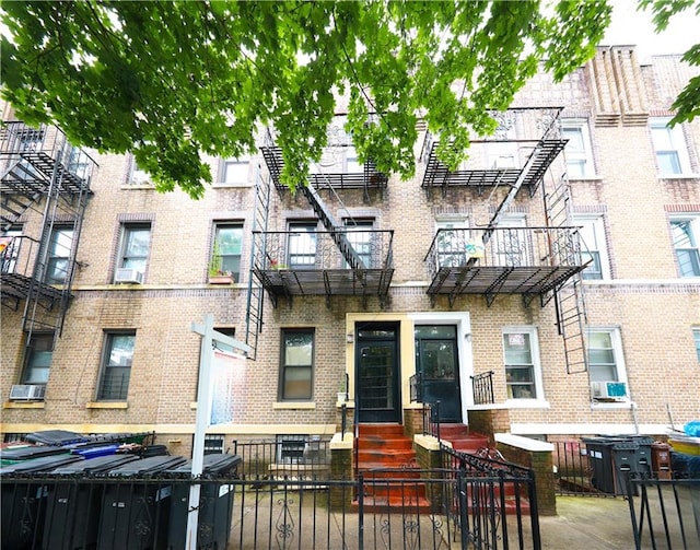 526 77th St, Brooklyn, NY 11209 - view of front of house with brick siding and a fenced front yard