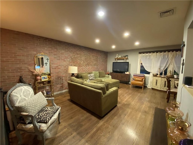 311 Giffords Ln, Staten Island, NY 10308 - living room with dark wood-style flooring, recessed lighting, and brick wall
