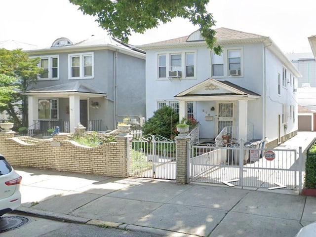 210 62nd St, Brooklyn, NY 11220 - traditional style home with a fenced front yard, a gate, stucco siding, and a porch