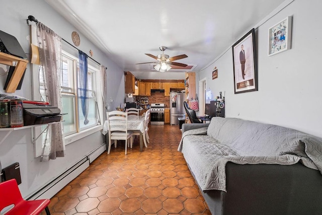 32 Brighton 2nd Pl, Brooklyn, NY 11235 - living area featuring baseboard heating, a ceiling fan, and tile patterned floors