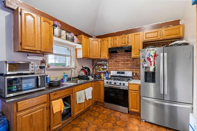 32 Brighton 2nd Pl, Brooklyn, NY 11235 - kitchen featuring appliances with stainless steel finishes, ventilation hood, lofted ceiling, backsplash, and dark countertops