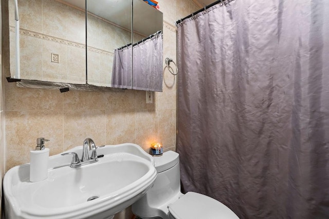 32 Brighton 2nd Pl, Brooklyn, NY 11235 - full bathroom with tile walls and a shower with shower curtain