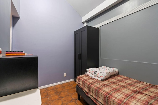 32 Brighton 2nd Pl, Brooklyn, NY 11235 - bedroom featuring baseboards and lofted ceiling