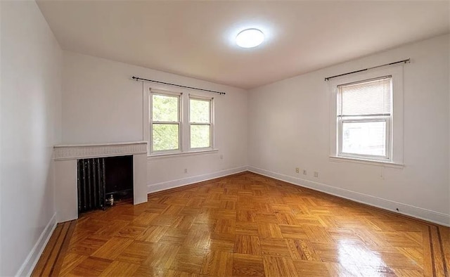 1745 E 21st St, Brooklyn, NY 11229 - unfurnished living room featuring baseboards and a fireplace