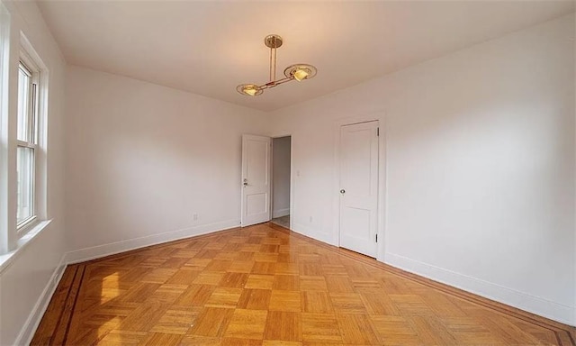 1745 E 21st St, Brooklyn, NY 11229 - spare room with healthy amount of natural light and a chandelier