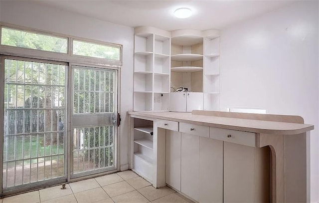 1745 E 21st St, Brooklyn, NY 11229 - interior space with open shelves, light tile patterned floors, and light countertops