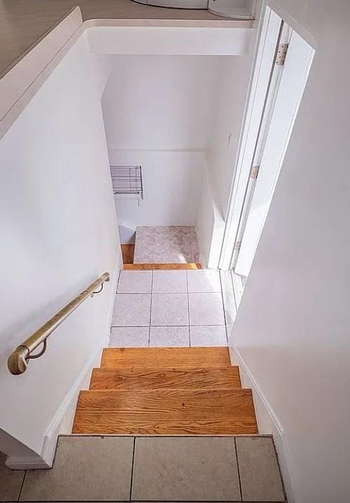 1745 E 21st St, Brooklyn, NY 11229 - staircase with tile patterned flooring