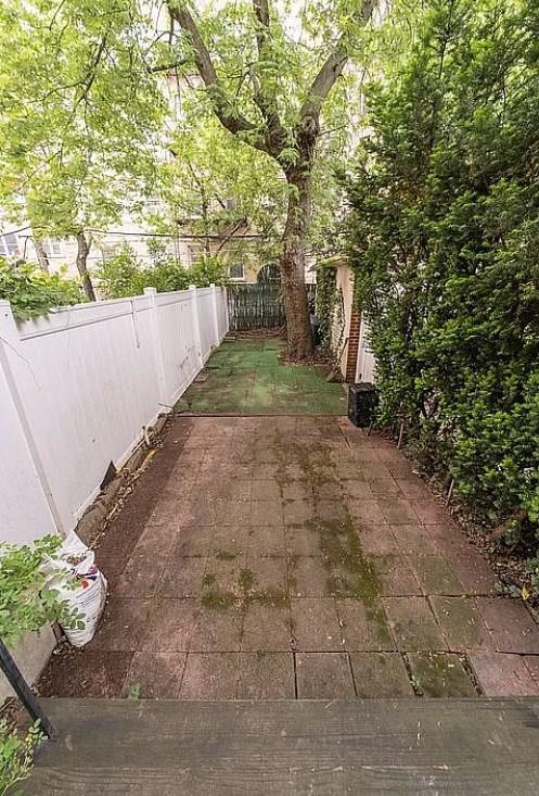 1745 E 21st St, Brooklyn, NY 11229 - fenced backyard with a patio