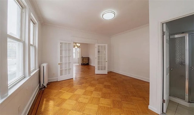 1745 E 21st St, Brooklyn, NY 11229 - spare room with french doors, radiator, a chandelier, and crown molding