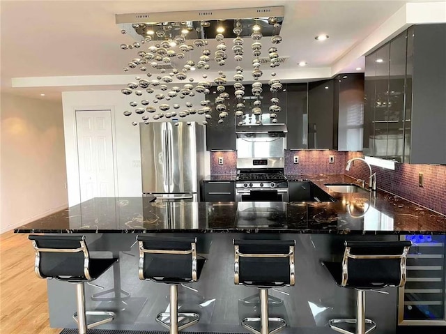 6511 Fort Hamilton Pkwy Unit 3C, Brooklyn, NY 11219 - bar area with stainless steel appliances, wine cooler, decorative backsplash, under cabinet range hood, and recessed lighting
