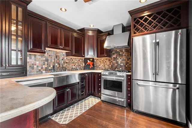 41 Bent St, Staten Island, NY 10312 - kitchen with stainless steel appliances, wall chimney exhaust hood, dark wood-style floors, backsplash, and recessed lighting