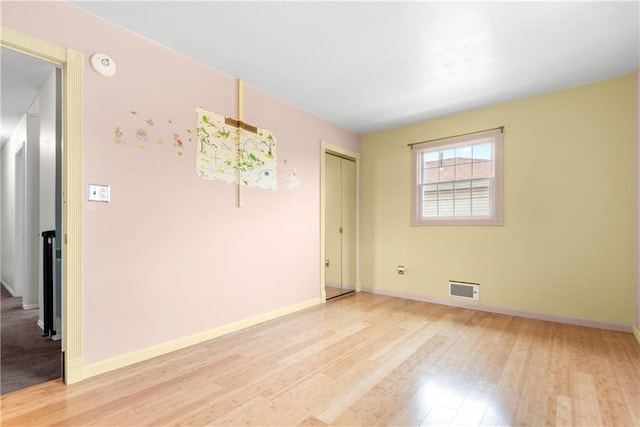 41 Bent St, Staten Island, NY 10312 - empty room with light wood-style floors and a smoke detector