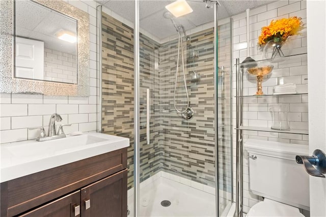 41 Bent St, Staten Island, NY 10312 - bathroom featuring tile walls, vanity, a stall shower, and decorative backsplash