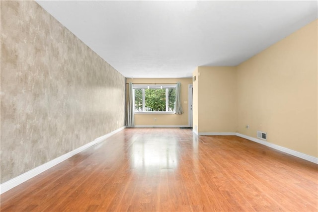 41 Bent St, Staten Island, NY 10312 - empty room with wood finished floors and baseboards