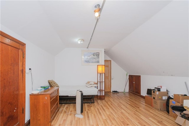 4070 Victory Blvd, Staten Island, NY 10314 - bedroom with light wood-style floors and vaulted ceiling