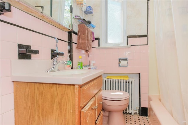 4070 Victory Blvd, Staten Island, NY 10314 - bathroom with tile walls, vanity, radiator, plenty of natural light, and shower / bath combination with curtain