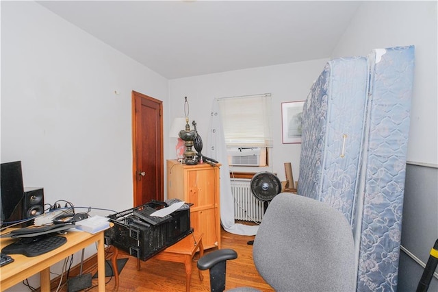 4070 Victory Blvd, Staten Island, NY 10314 - office featuring radiator heating unit, wood finished floors, and cooling unit