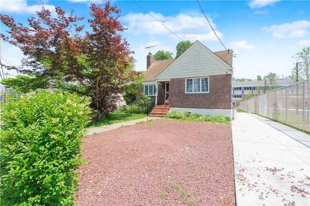 4070 Victory Blvd, Staten Island, NY 10314 - bungalow-style house with brick siding and a chimney