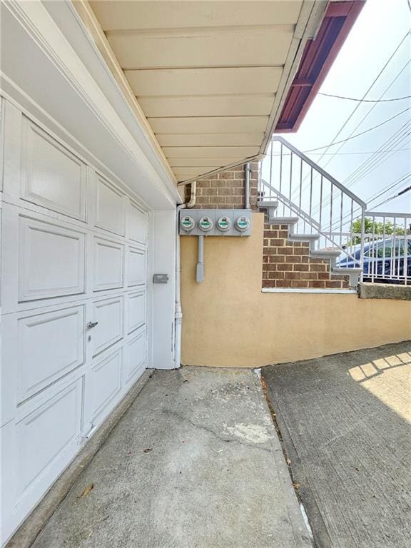 1205 65th St Unit A, Brooklyn, NY 11219 - view of patio / terrace featuring a garage and stairway