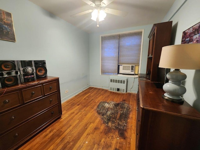 2251 Plumb St Unit 6B, Brooklyn, NY 11229 - office with radiator heating unit, cooling unit, a ceiling fan, and wood finished floors