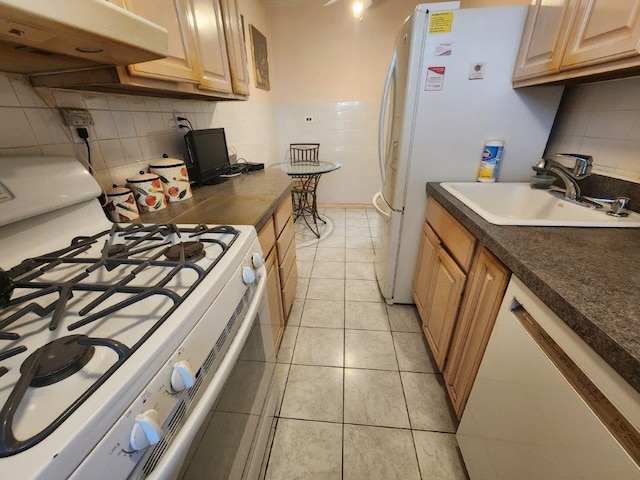 2251 Plumb St Unit 6B, Brooklyn, NY 11229 - kitchen featuring gas range gas stove, under cabinet range hood, backsplash, light tile patterned flooring, and dark countertops