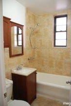 9524 Fort Hamilton Pkwy Unit 601, Brooklyn, NY 11209 - bathroom with vanity and bathtub / shower combination