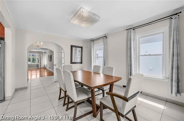 2160 E 36th St, Brooklyn, NY 11234 - dining space with arched walkways and light tile patterned flooring