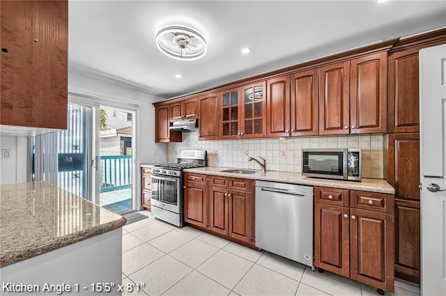2160 E 36th St, Brooklyn, NY 11234 - kitchen featuring appliances with stainless steel finishes, decorative backsplash, light stone counters, glass insert cabinets, and recessed lighting
