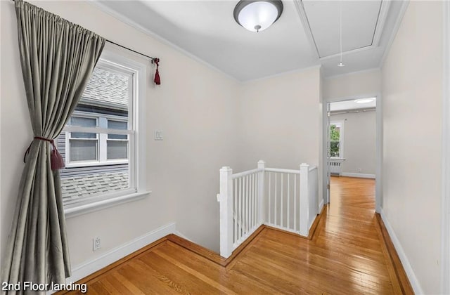 2160 E 36th St, Brooklyn, NY 11234 - corridor featuring an upstairs landing, attic access, wood finished floors, crown molding, and radiator