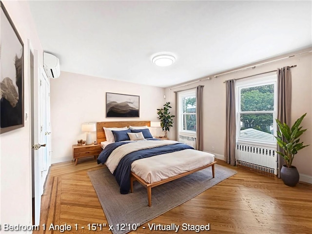 2160 E 36th St, Brooklyn, NY 11234 - bedroom featuring radiator, an AC wall unit, and light wood-style flooring